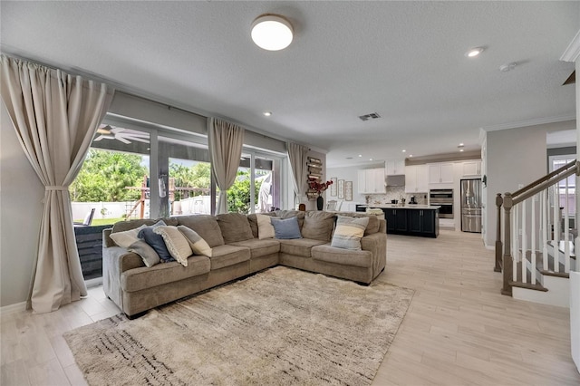 10399 Boyette Brook St, Riverview, FL 33569 - living room featuring ornamental molding, ceiling fan, stairway, recessed lighting, and light wood-style floors