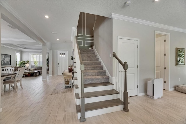 10399 Boyette Brook St, Riverview, FL 33569 - stairway with wood finished floors, ornamental molding, and recessed lighting
