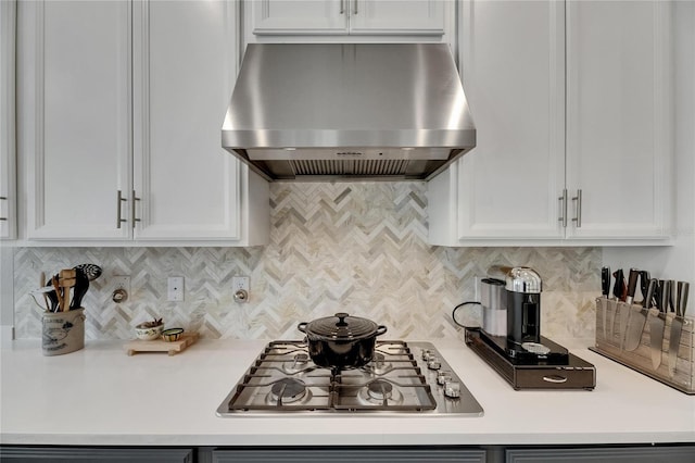 10399 Boyette Brook St, Riverview, FL 33569 - kitchen featuring island range hood, stainless steel gas stovetop, light countertops, white cabinetry, and tasteful backsplash
