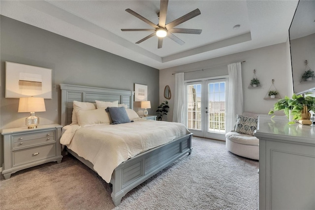10399 Boyette Brook St, Riverview, FL 33569 - bedroom featuring light carpet, access to outside, a tray ceiling, french doors, and a ceiling fan