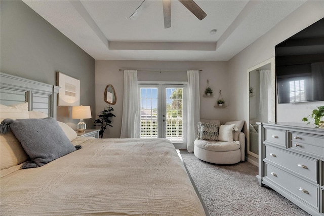 10399 Boyette Brook St, Riverview, FL 33569 - bedroom with access to outside, light colored carpet, a tray ceiling, french doors, and a ceiling fan