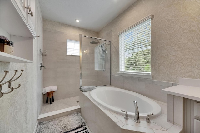 10399 Boyette Brook St, Riverview, FL 33569 - full bathroom featuring a garden tub, a stall shower, and wallpapered walls