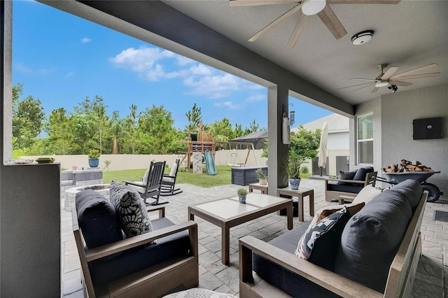 10399 Boyette Brook St, Riverview, FL 33569 - fenced backyard with an outdoor living space, a ceiling fan, a playground, and a patio area