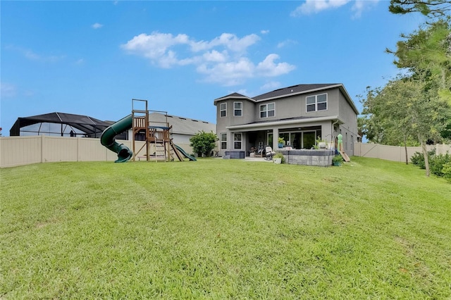10399 Boyette Brook St, Riverview, FL 33569 - back of house with a playground, a fenced backyard, a patio, stucco siding, and outdoor lounge area