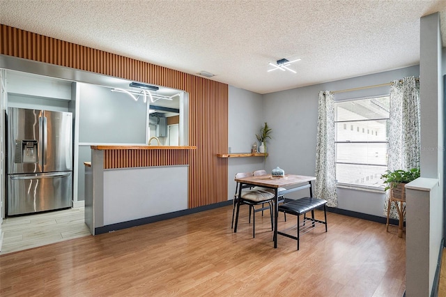 15906 Country Farm Pl, Tampa, FL 33624 - dining room featuring wood finished floors and a textured ceiling