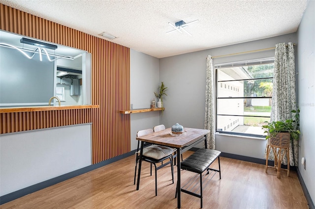 15906 Country Farm Pl, Tampa, FL 33624 - dining room featuring wood finished floors and a textured ceiling