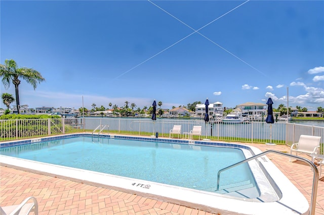 340 Pinellas Bayway S Unit 304, Saint Petersburg, FL 33715 - community pool with a fenced backyard and a residential view