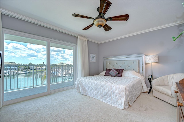 340 Pinellas Bayway S Unit 304, Saint Petersburg, FL 33715 - bedroom with access to exterior, ornamental molding, a water view, carpet, and ceiling fan