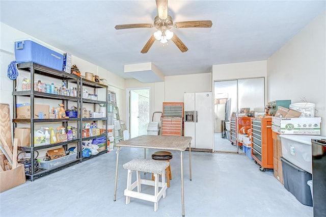 340 Pinellas Bayway S Unit 304, Saint Petersburg, FL 33715 - kitchen featuring white refrigerator with ice dispenser, finished concrete floors, and ceiling fan