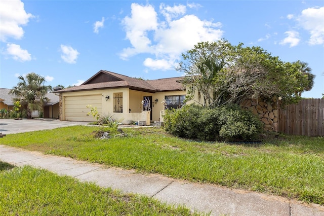 7018 Arbor View Ln, New Port Richey, FL 34653 - view of front of property with stucco siding, driveway, and a garage