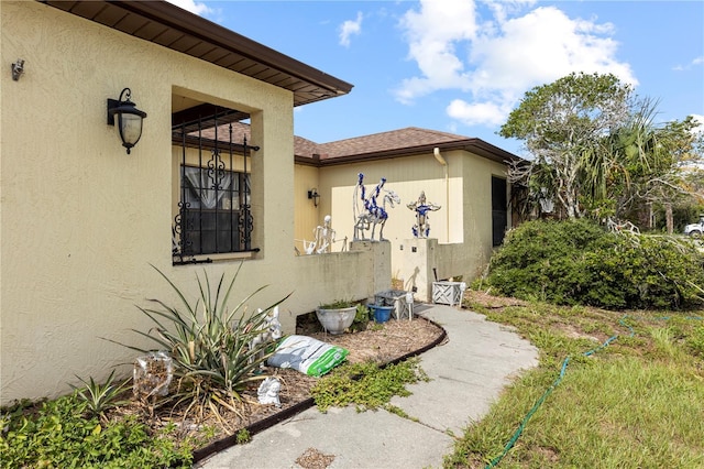 7018 Arbor View Ln, New Port Richey, FL 34653 - view of exterior entry featuring stucco siding