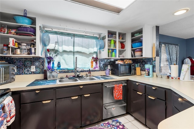 7018 Arbor View Ln, New Port Richey, FL 34653 - kitchen with black microwave, light countertops, light tile patterned floors, and open shelves