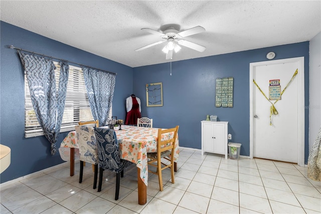 7018 Arbor View Ln, New Port Richey, FL 34653 - dining area featuring ceiling fan, light tile patterned floors, and a textured ceiling