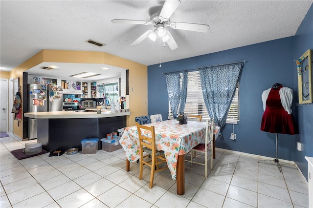 7018 Arbor View Ln, New Port Richey, FL 34653 - dining area featuring a textured ceiling, ceiling fan, and light tile patterned floors