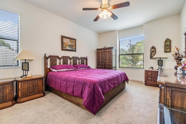 12251 Duckett Ct, Spring Hill, FL 34610 - bedroom featuring carpet floors and a ceiling fan