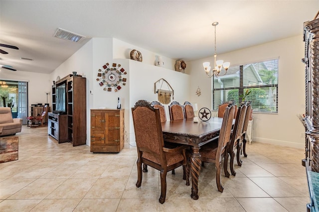 12251 Duckett Ct, Spring Hill, FL 34610 - dining space with a chandelier, light tile patterned floors, and ceiling fan
