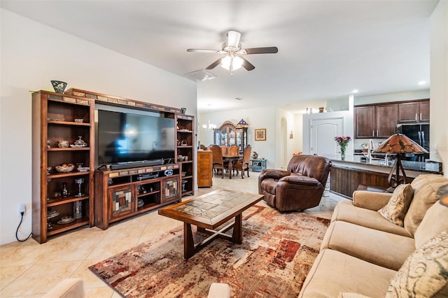 12251 Duckett Ct, Spring Hill, FL 34610 - living area featuring ceiling fan, light tile patterned flooring, arched walkways, and recessed lighting