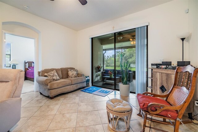 12251 Duckett Ct, Spring Hill, FL 34610 - living area with a ceiling fan and light tile patterned flooring