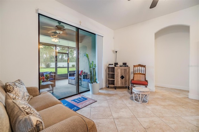 12251 Duckett Ct, Spring Hill, FL 34610 - living room featuring a ceiling fan, arched walkways, and tile patterned flooring