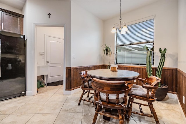 12251 Duckett Ct, Spring Hill, FL 34610 - dining space with wainscoting, wood walls, and light tile patterned flooring