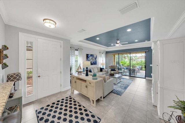 10450 Highland Park Pl, Palmetto, FL 34221 - living room featuring crown molding, a raised ceiling, ceiling fan, light tile patterned floors, and recessed lighting