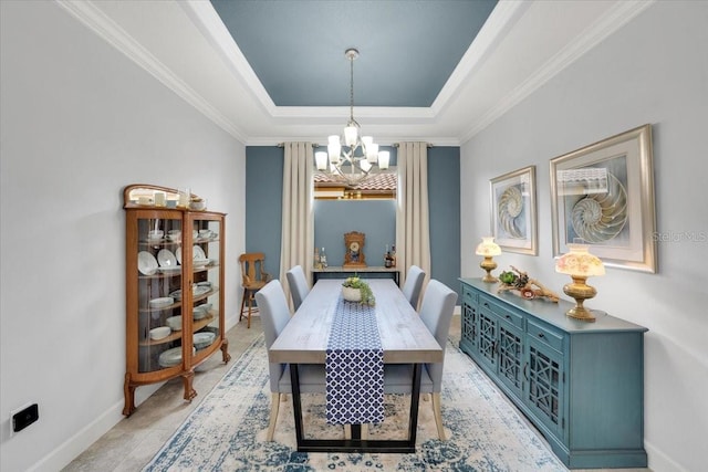 10450 Highland Park Pl, Palmetto, FL 34221 - dining space featuring a chandelier, a tray ceiling, and ornamental molding