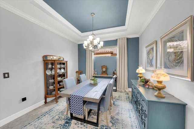 10450 Highland Park Pl, Palmetto, FL 34221 - dining area with a chandelier, a raised ceiling, and ornamental molding