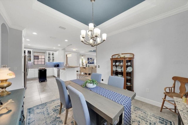 10450 Highland Park Pl, Palmetto, FL 34221 - dining room featuring crown molding, a chandelier, light tile patterned floors, recessed lighting, and a tray ceiling