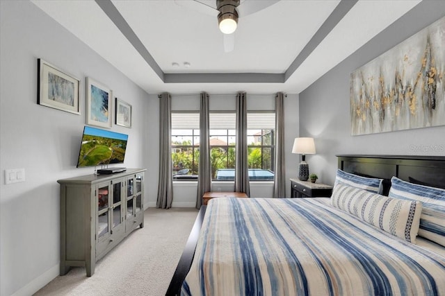 10450 Highland Park Pl, Palmetto, FL 34221 - carpeted bedroom with a tray ceiling and a ceiling fan