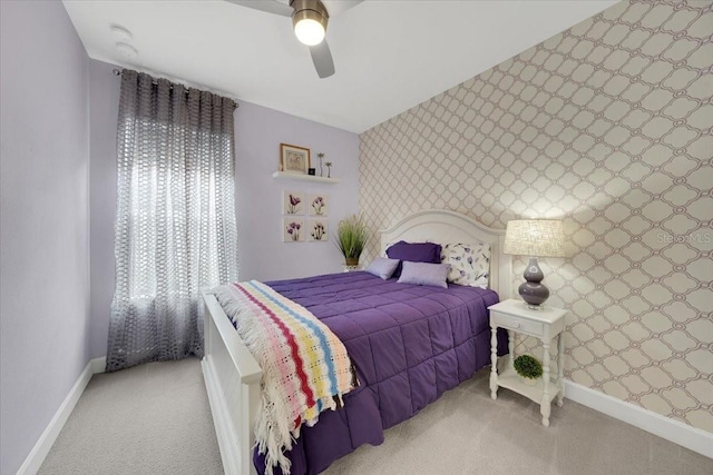 10450 Highland Park Pl, Palmetto, FL 34221 - carpeted bedroom featuring wallpapered walls, ceiling fan, and an accent wall