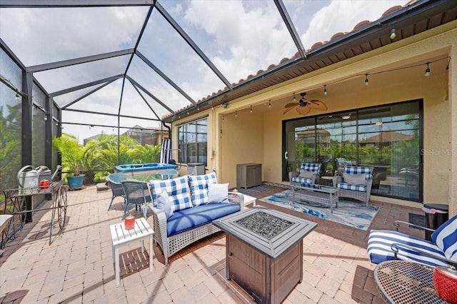 10450 Highland Park Pl, Palmetto, FL 34221 - view of patio with a hot tub, an outdoor living space with a fire pit, a lanai, and ceiling fan