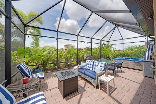 10450 Highland Park Pl, Palmetto, FL 34221 - view of patio / terrace featuring a covered hot tub, an outdoor fire pit, glass enclosure, and outdoor dining area