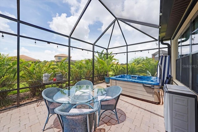 10450 Highland Park Pl, Palmetto, FL 34221 - view of patio with a hot tub, a lanai, and outdoor dining space