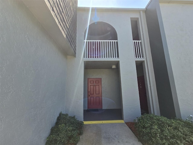 3123 29th Ave N Unit 105, Saint Petersburg, FL 33713 - view of exterior entry featuring stucco siding and a balcony