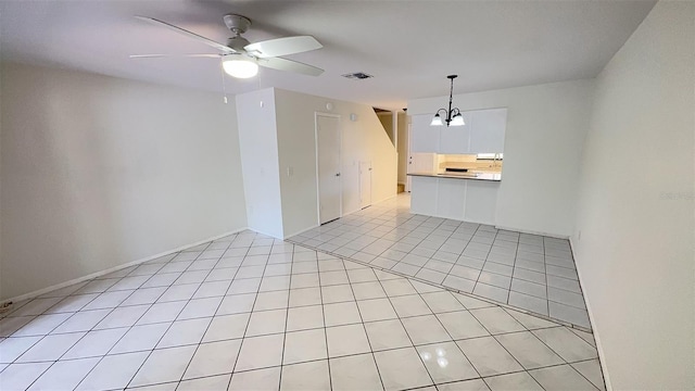 4003 Oak Limb Ct, Tampa, FL 33614 - unfurnished living room featuring a chandelier, a ceiling fan, and light tile patterned floors