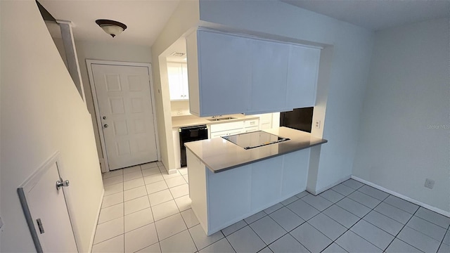 4003 Oak Limb Ct, Tampa, FL 33614 - kitchen featuring black appliances, light tile patterned flooring, a peninsula, and light countertops