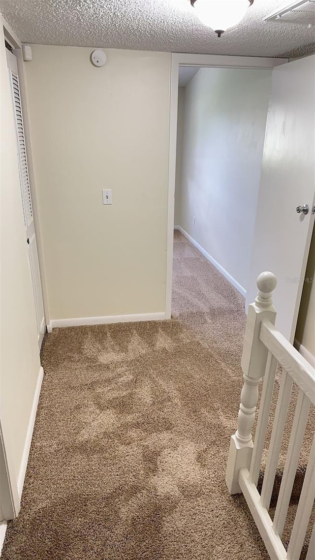 4003 Oak Limb Ct, Tampa, FL 33614 - unfurnished room with carpet floors, a textured ceiling, and a smoke detector