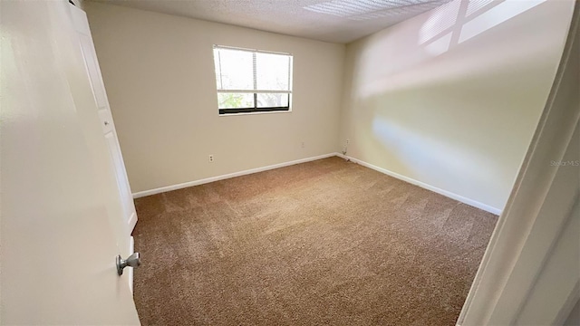 4003 Oak Limb Ct, Tampa, FL 33614 - carpeted empty room with a textured ceiling and baseboards
