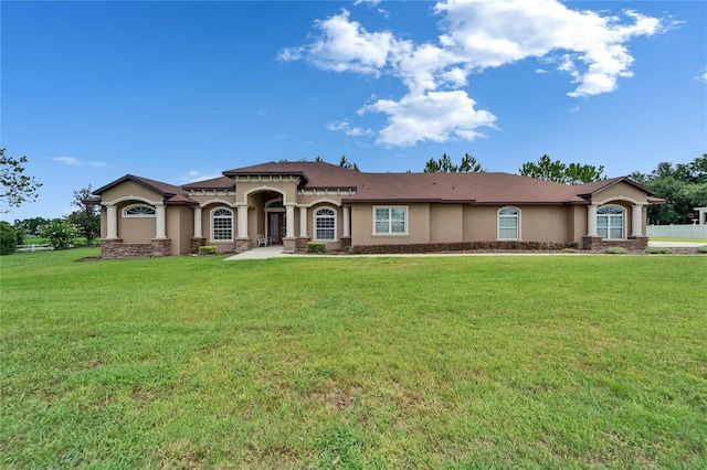 13102 Done Groven Dr, Dover, FL 33527 - mediterranean / spanish-style home featuring stucco siding and a front lawn
