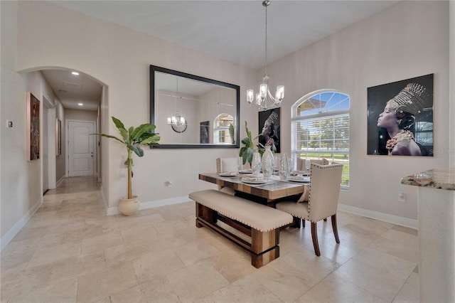 13102 Done Groven Dr, Dover, FL 33527 - dining space with a chandelier and arched walkways