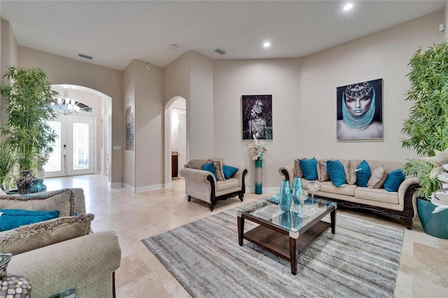 13102 Done Groven Dr, Dover, FL 33527 - living room with arched walkways, a chandelier, and recessed lighting
