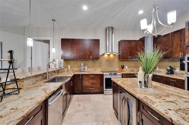 13102 Done Groven Dr, Dover, FL 33527 - kitchen featuring stainless steel appliances, wall chimney exhaust hood, decorative backsplash, hanging light fixtures, and recessed lighting