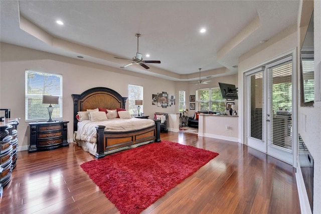 13102 Done Groven Dr, Dover, FL 33527 - bedroom featuring a raised ceiling, access to outside, wood finished floors, and recessed lighting
