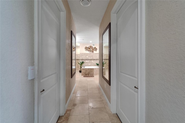 13102 Done Groven Dr, Dover, FL 33527 - corridor with a textured wall and light tile patterned flooring