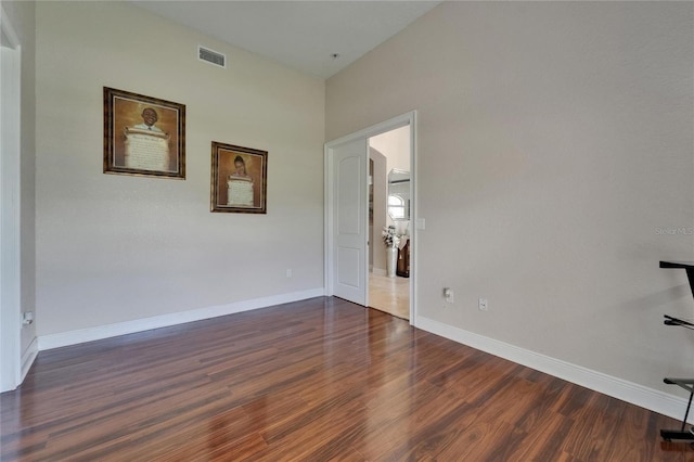 13102 Done Groven Dr, Dover, FL 33527 - empty room featuring dark wood-style flooring and arched walkways