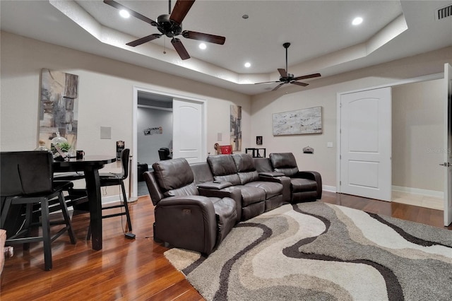 13102 Done Groven Dr, Dover, FL 33527 - cinema featuring ceiling fan, a tray ceiling, wood finished floors, and recessed lighting