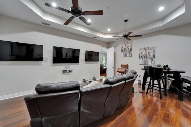 13102 Done Groven Dr, Dover, FL 33527 - living room featuring ceiling fan, a tray ceiling, dark wood-type flooring, and recessed lighting