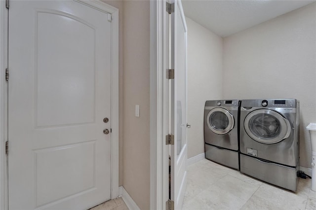 13102 Done Groven Dr, Dover, FL 33527 - washroom with separate washer and dryer and baseboards