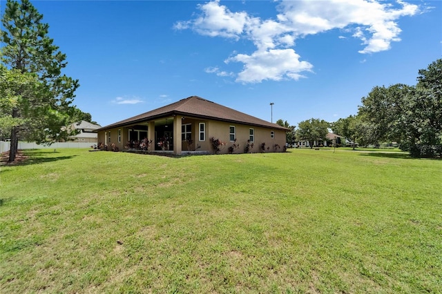 13102 Done Groven Dr, Dover, FL 33527 - rear view of house featuring a yard