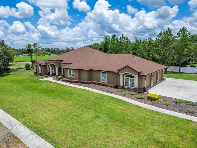 13102 Done Groven Dr, Dover, FL 33527 - view of front of home with stucco siding, concrete driveway, a garage, and roof with shingles
